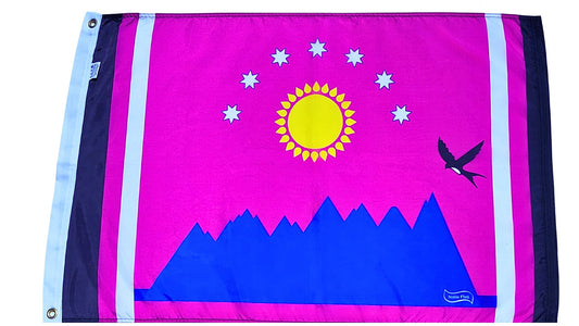 Sun and stars over mountains with bird